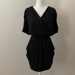 Casual business or cocktail dress with pockets.
